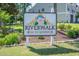 Riverwalk on the Waterway sign surrounded by rocks and lush plants at 1505 Lantern Rest Dr. # 301, Myrtle Beach, SC 29579