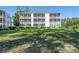 Three-story condo with multiple screened-in porches and a well-manicured lawn at 1505 Lantern Rest Dr. # 301, Myrtle Beach, SC 29579