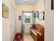 Cozy foyer with tiled floor, wooden bench, and natural light through a window at 1505 Lantern Rest Dr. # 301, Myrtle Beach, SC 29579