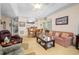 Bright and spacious living room featuring a view into the dining area and a comfortable seating arrangement at 1505 Lantern Rest Dr. # 301, Myrtle Beach, SC 29579