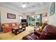 Inviting living room featuring comfy seating, a ceiling fan, and sliding glass doors at 1505 Lantern Rest Dr. # 301, Myrtle Beach, SC 29579