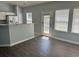 Dining area features a breakfast bar, wood floors and a glass panel door at 152 Rose Water Loop, Myrtle Beach, SC 29588