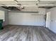 Spacious two-car garage featuring ample shelving, durable flooring, and clean walls at 152 Rose Water Loop, Myrtle Beach, SC 29588