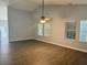 The living room features vaulted ceiling, wood floors, and an abundance of natural light at 152 Rose Water Loop, Myrtle Beach, SC 29588