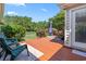 Spacious backyard with a wood deck, patio furniture, and privacy fence at 1609 Bridgebrook Ln., Conway, SC 29527