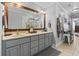 Bathroom with double sinks, framed mirror, updated vanity, and shower with glass doors at 1609 Bridgebrook Ln., Conway, SC 29527