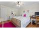 Well-lit bedroom showcasing hardwood floors, a full bed, and a white dresser at 1609 Bridgebrook Ln., Conway, SC 29527