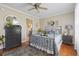 Charming bedroom featuring a plush rug, hardwood floors, and a stylish black dresser at 1609 Bridgebrook Ln., Conway, SC 29527
