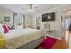 Bedroom featuring a full bed, stylish rug, and natural light from the large window at 1609 Bridgebrook Ln., Conway, SC 29527