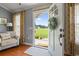 Inviting entryway with natural light, open door, and stylish interior decor at 1609 Bridgebrook Ln., Conway, SC 29527