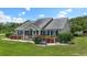Well maintained home exterior with lush landscaping and a welcoming front porch at 1609 Bridgebrook Ln., Conway, SC 29527