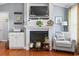 Elegant fireplace with mantel, built-in shelving, and cozy decorative accents at 1609 Bridgebrook Ln., Conway, SC 29527