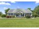 Charming home with manicured lawn, inviting front porch, and quaint welcome decor at 1609 Bridgebrook Ln., Conway, SC 29527