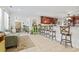 Open living room with views into the dining area and kitchen, featuring a comfortable couch at 1609 Bridgebrook Ln., Conway, SC 29527