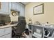 Functional office space boasts ample storage, dual monitors, and stylish decor at 1609 Bridgebrook Ln., Conway, SC 29527