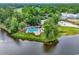Aerial view of the community pool with surrounding golf course and landscaping at 179 Golden Bear Dr. # C4, Pawleys Island, SC 29585