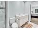 Bright bathroom featuring a double sink vanity, white cabinets, and glass enclosed shower at 179 Golden Bear Dr. # C4, Pawleys Island, SC 29585