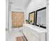 Elegant bathroom with dual sinks, large mirrors, white cabinets, and a patterned shower curtain at 179 Golden Bear Dr. # C4, Pawleys Island, SC 29585