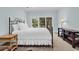 Bright bedroom featuring a comfortable bed, dresser and soft natural lighting at 179 Golden Bear Dr. # C4, Pawleys Island, SC 29585