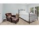 Cozy bedroom featuring a comfortable bed, leather armchair and soft natural lighting at 179 Golden Bear Dr. # C4, Pawleys Island, SC 29585