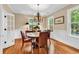 Dining room featuring a chandelier, hardwood floors and a table with seating for four at 179 Golden Bear Dr. # C4, Pawleys Island, SC 29585