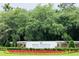 Welcome to Pawleys Plantation Golf and Country Club sign surrounded by vibrant flowers and greenery at 179 Golden Bear Dr. # C4, Pawleys Island, SC 29585