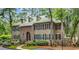 Charming two-story home boasts a lush, landscaped yard and a durable, low-maintenance metal roof at 179 Golden Bear Dr. # C4, Pawleys Island, SC 29585