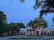 Stately southern home featuring white columns and inviting landscaped grounds at 179 Golden Bear Dr. # C4, Pawleys Island, SC 29585