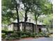 Stately multi-story home with beautiful landscaping, green roof and brick entryway at 179 Golden Bear Dr. # C4, Pawleys Island, SC 29585