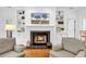 Close up shot of a living room fireplace with custom shelving and detailed tile work at 179 Golden Bear Dr. # C4, Pawleys Island, SC 29585