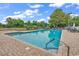 Community pool featuring ample seating, brick surround, and well maintained landscaping at 179 Golden Bear Dr. # C4, Pawleys Island, SC 29585
