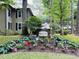 Entrance to Pawleys Glen featuring attractive landscaping, flowers, and community signage at 179 Golden Bear Dr. # C4, Pawleys Island, SC 29585