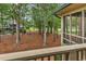 Screened porch features tranquil views of trees, landscaping, and the adjacent golf course at 179 Golden Bear Dr. # C4, Pawleys Island, SC 29585