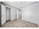 This room features wood-look floors, a closet, neutral walls, and an open doorway at 1962 Pint Circle, Longs, SC 29568