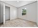 Bright bedroom with wood-look floors, a window, and an ample closet at 1962 Pint Circle, Longs, SC 29568