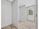 Hallway featuring an exterior door with sidelights and wood-look flooring at 1962 Pint Circle, Longs, SC 29568