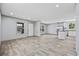 Bright living room with an open floor plan leading to the kitchen with stainless steel appliances at 1962 Pint Circle, Longs, SC 29568