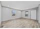 An open-concept living area with wood-look floors, neutral walls, and natural light at 1962 Pint Circle, Longs, SC 29568