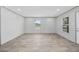 A modern living room with light grey walls and wood flooring at 1962 Pint Circle, Longs, SC 29568