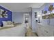 Bright bedroom with two beds, white dresser, and access to the hallway at 2001 S Ocean Blvd. # 1504, Myrtle Beach, SC 29577