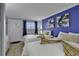 Bedroom with two beds, window, and vibrant blue accent wall at Bluewater Resort #1504 at 2001 S Ocean Blvd. # 1504, Myrtle Beach, SC 29577