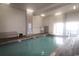 Bright indoor pool with basketball hoop, bench, and pool rules at 2001 S Ocean Blvd. # 1504, Myrtle Beach, SC 29577