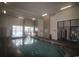 Bright indoor pool with a staircase and large windows providing natural light at 2001 S Ocean Blvd. # 1504, Myrtle Beach, SC 29577