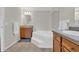 Spacious bathroom featuring a corner bathtub, double vanities, and ample lighting at 203 Warbler St., Georgetown, SC 29440