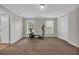 Bedroom showcasing natural light, brown carpet, exercise equipment, and neutral colored walls at 203 Warbler St., Georgetown, SC 29440