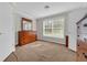 Bedroom with wooden furniture, natural light, and neutral walls and carpet flooring at 203 Warbler St., Georgetown, SC 29440