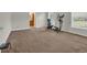 Bright bedroom featuring an elliptical machine and plenty of natural light from the large window at 203 Warbler St., Georgetown, SC 29440