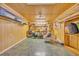Dedicated craft room featuring wood paneled walls and shelving for storage, a worktable, and tiled floors at 203 Warbler St., Georgetown, SC 29440