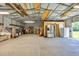 The garage has a large interior with concrete floor and an open ceiling, ready for storage and activities at 203 Warbler St., Georgetown, SC 29440