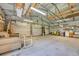 Large metal garage interior featuring concrete floors, open ceiling, and ample space for storage and activities at 203 Warbler St., Georgetown, SC 29440